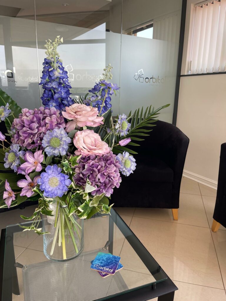 Subtle pastel silk flowers for retail displays and office interiors